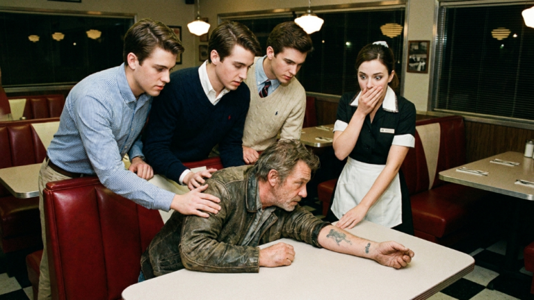NEXT PART – FOUR TRUST-FUND BOYS DRAGGED THE WASHED-UP OLD BIKER OUT OF HIS DINER BOOTH AND SLAMMED HIS FACE AGAINST THE TABLE — UNTIL THE TATTOO ON HIS WRIST MADE THE WAITRESS STOP BREATHING